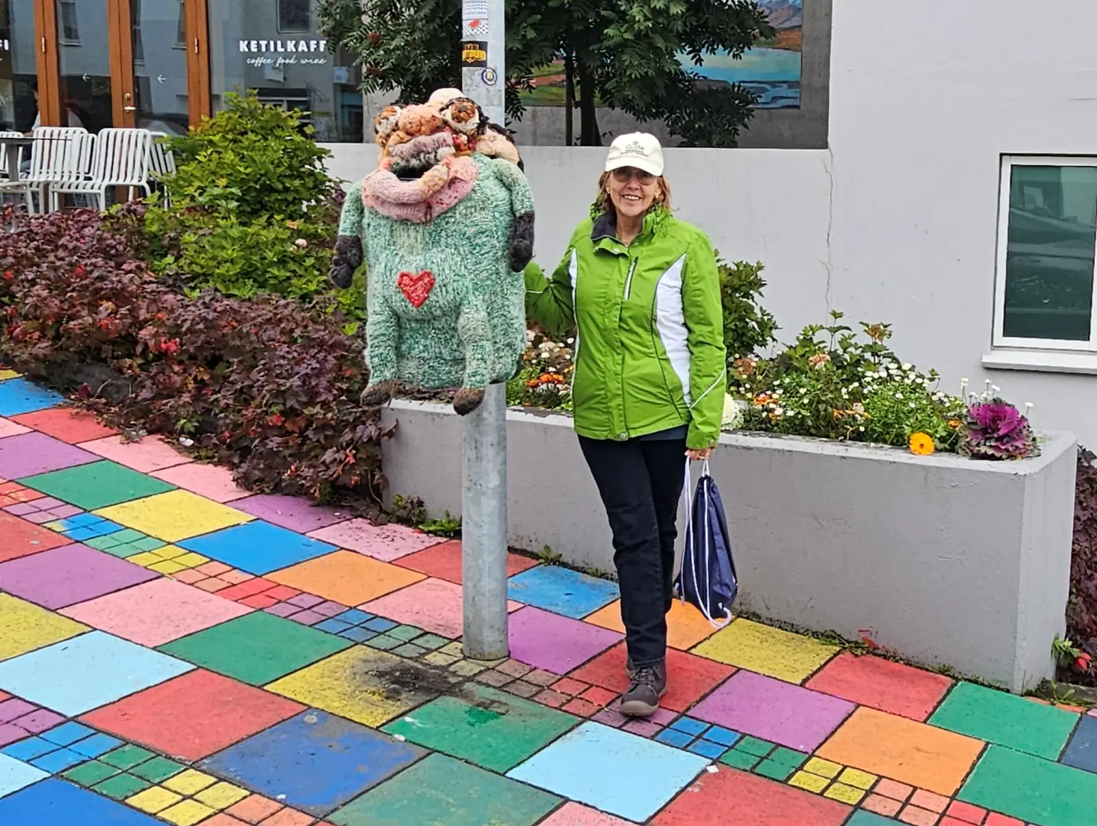 Troll trash can cover in downtown Akureyri