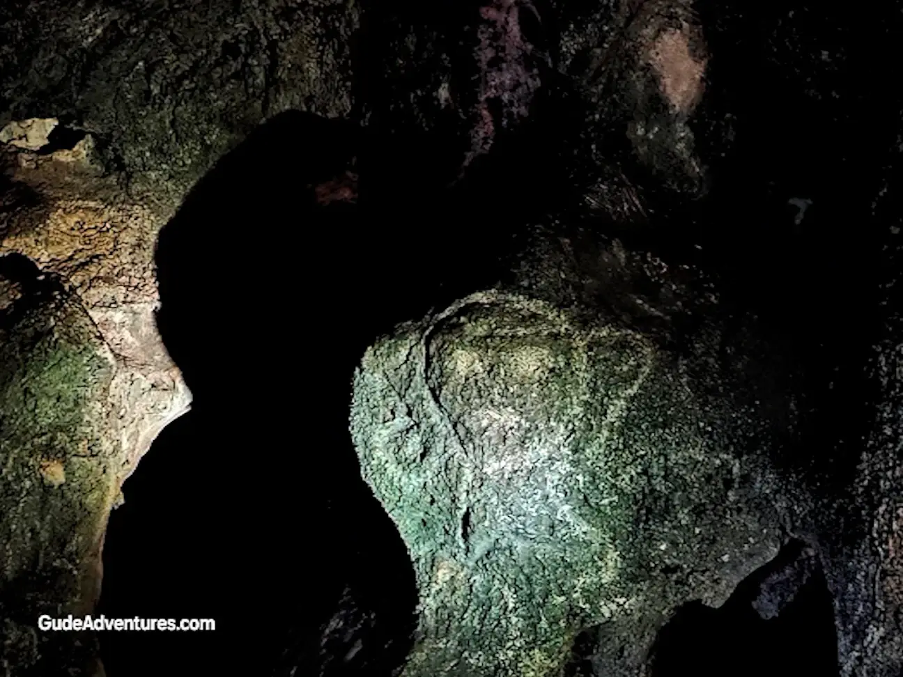 Ancient Taino petroglyph on one of the stalactites in the cave.