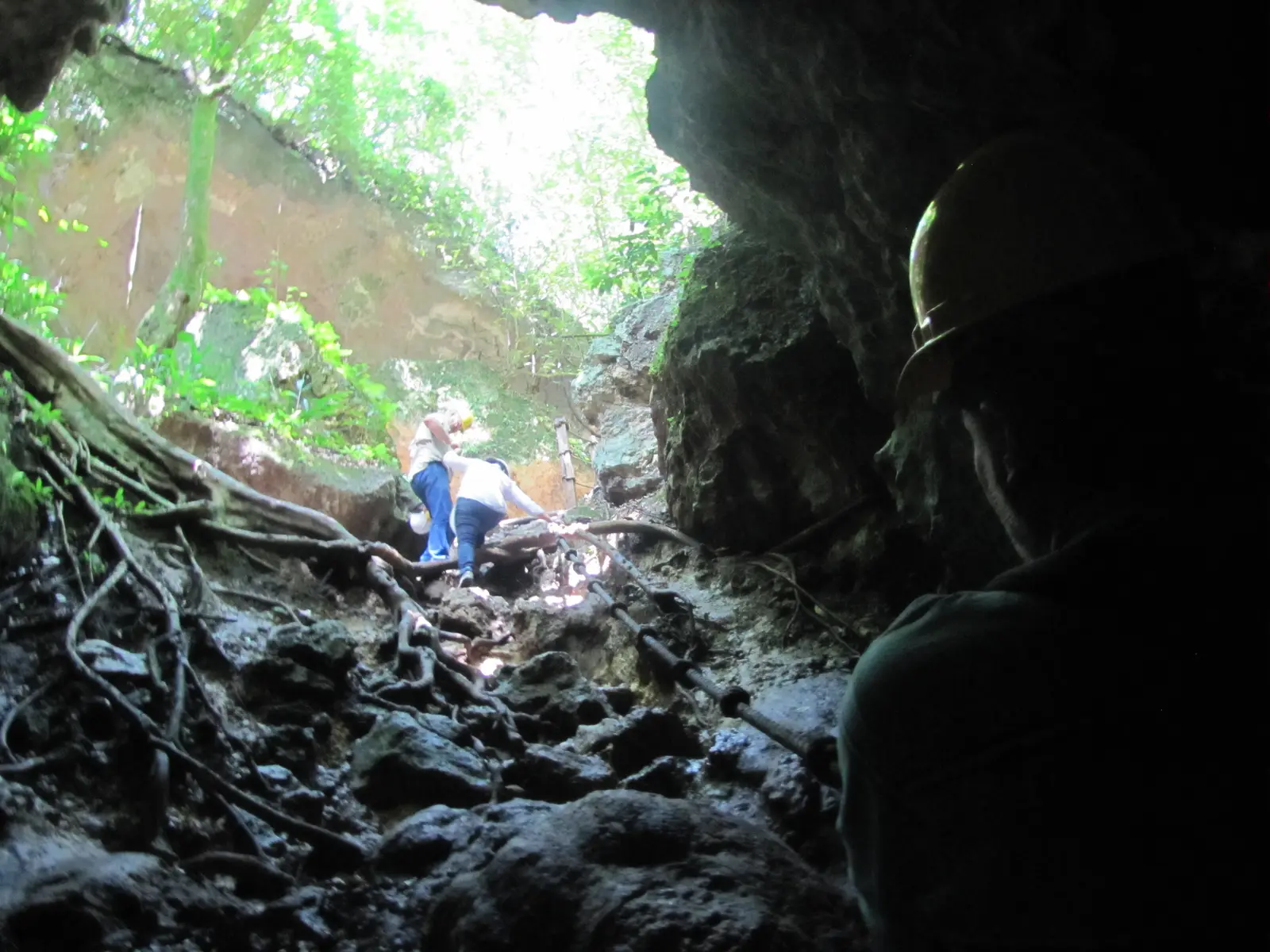Climbing out of the cave by pulling yourself up the rope. This has been replaced with a stairway.
