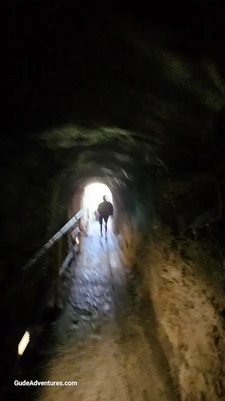 Tunnel through the wall of the rim near the top of the crater.