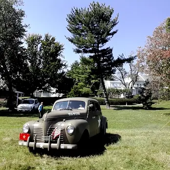 Military staff car in front of the Eisenhower home