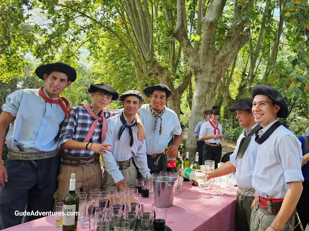 Gauchos serving wine