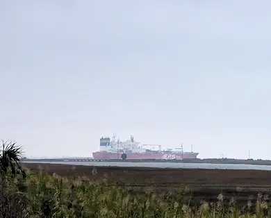 Ship exiting Galveston Bay at the East end of Galveston Island