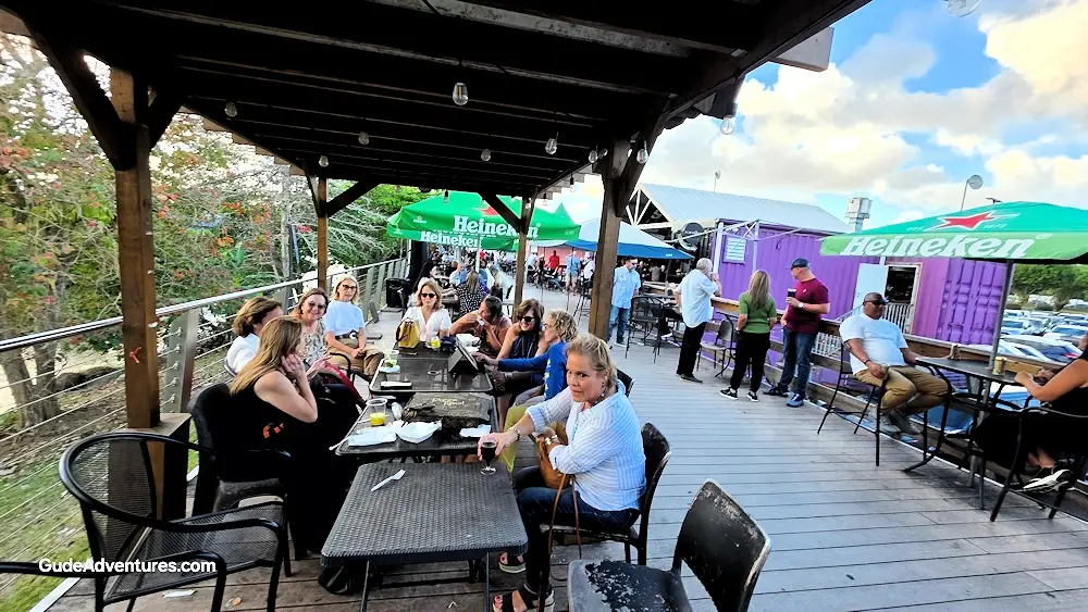 Tables along the riverfront at Paseo Tablado de Guaynabo