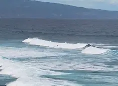 Surfers in Hookipa bay
