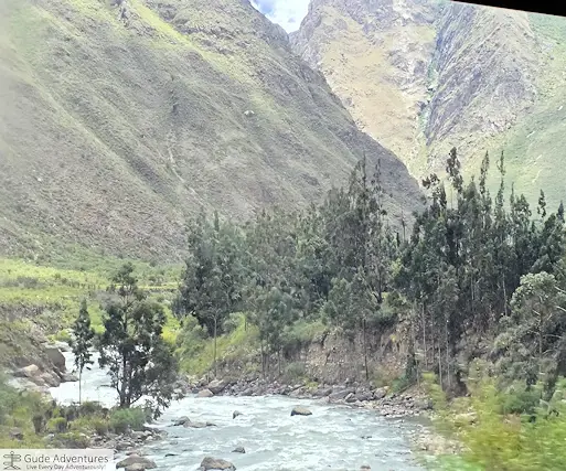 The train and Inca Trail follow the Urubamba River through the narrow valley