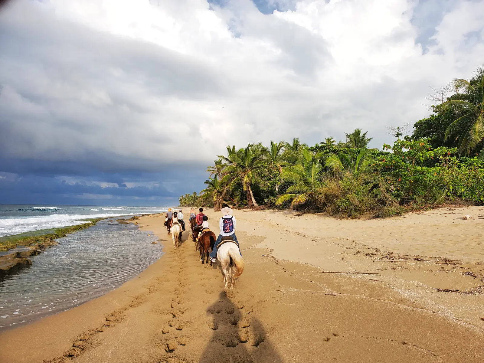 Horseback riding on the beach.