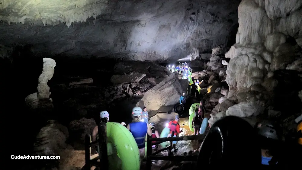 Walking through the cave to the start point for the tubing