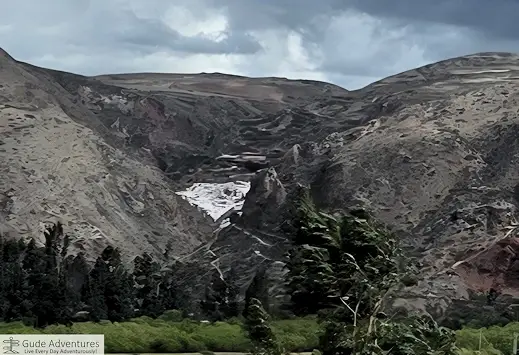 The dazzling white salt pools cascade down the mountainside