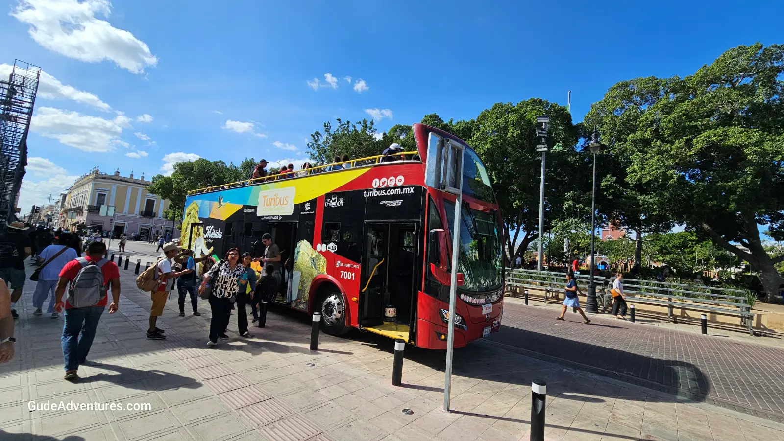 Getting on the Hop on Hop off bus in front of the Catedral de San Ildefonso