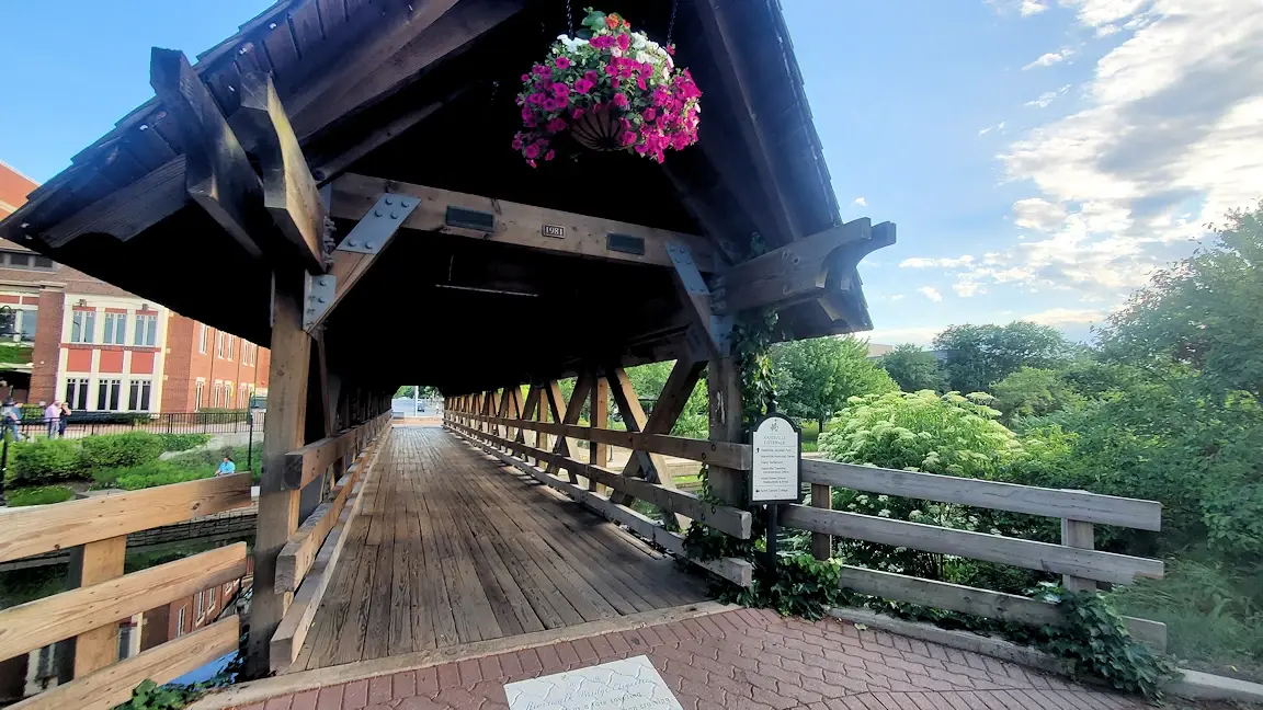 Wooden bridge over the DuPage River on the Naperville Riverwalk