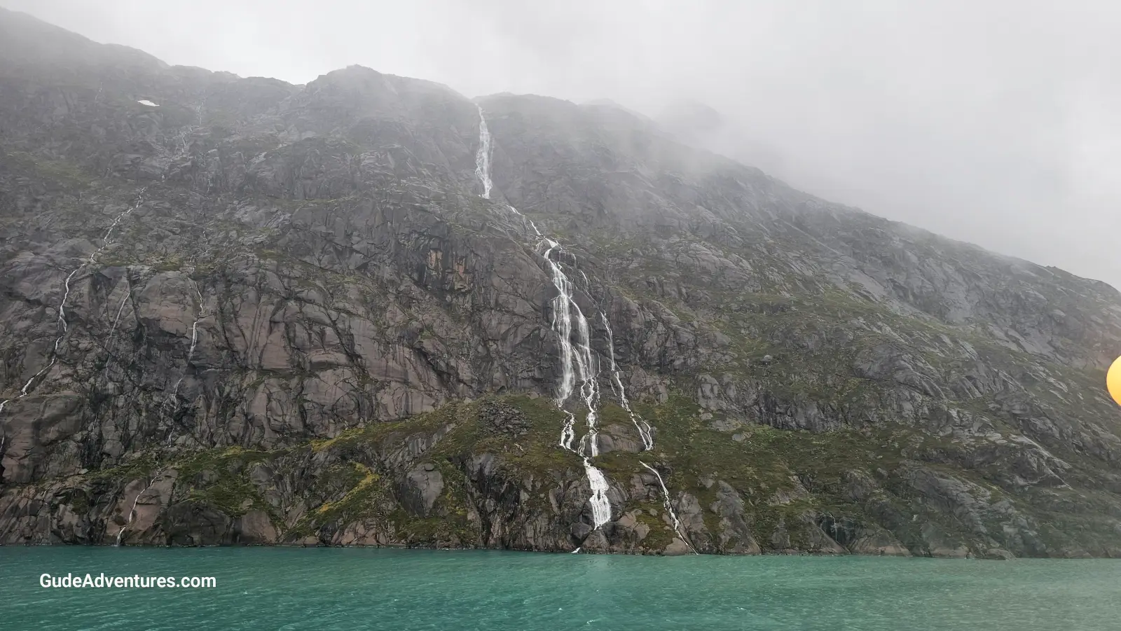 Tall waterfall in the fjord