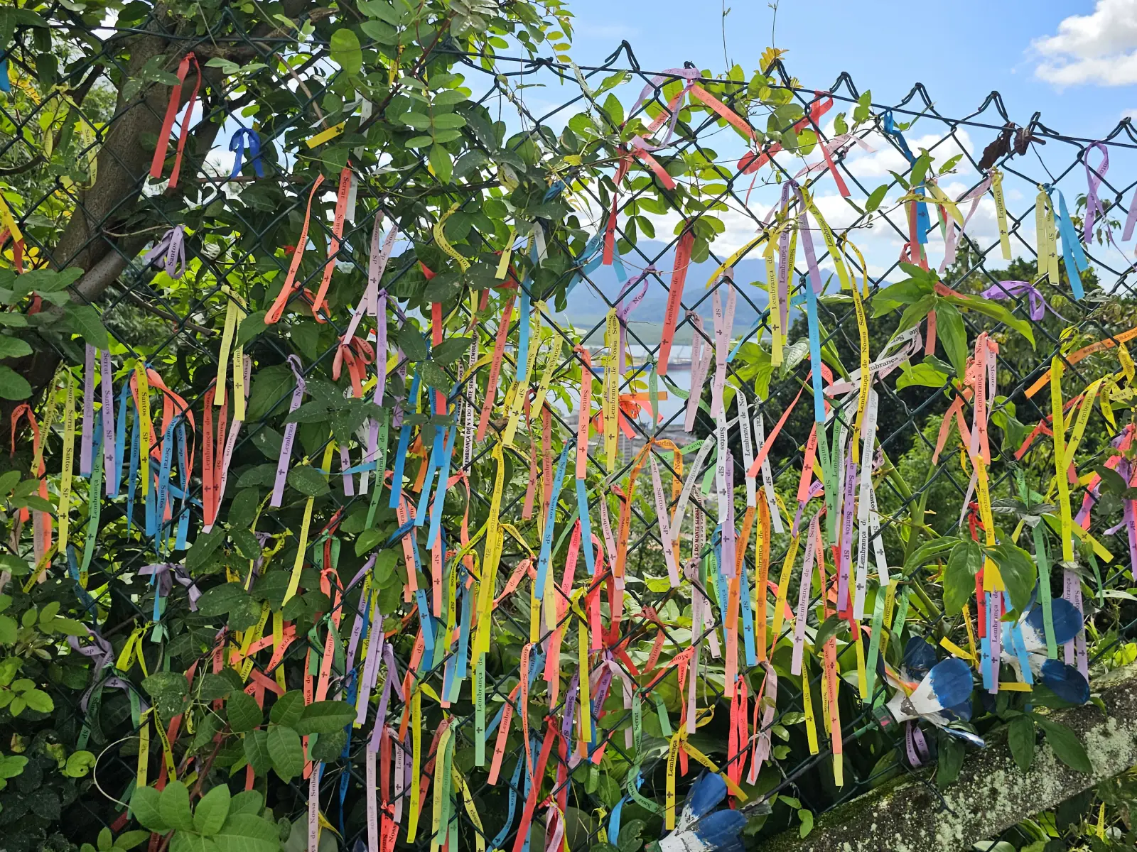 Prayer ribbons on the fence near the church.