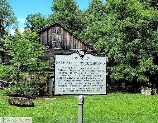 Sign about Prehistoric Rock Carvings at Hagood Mill