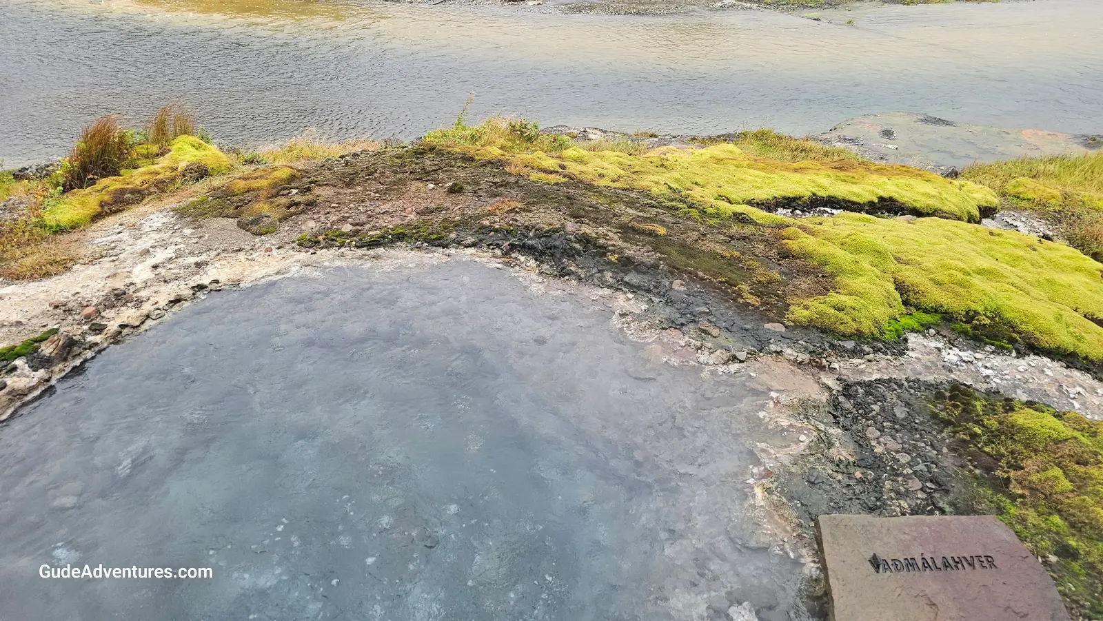 One of the boiling hot springs next to the river.