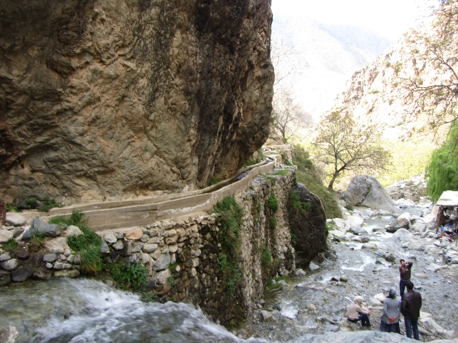An aqueduct follows the river down the mountain.