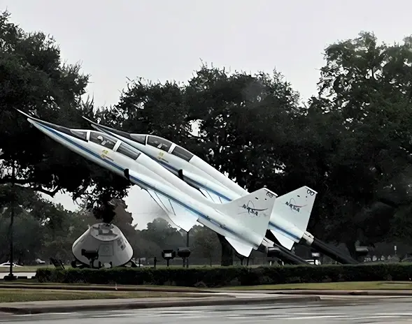 Space capsule and a pair of NASA jets at the entrance to Space Center Houston