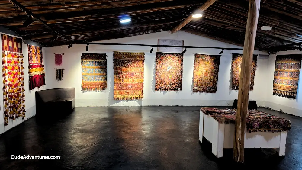 Hand woven rugs available for sale at the Sulca Textile Center