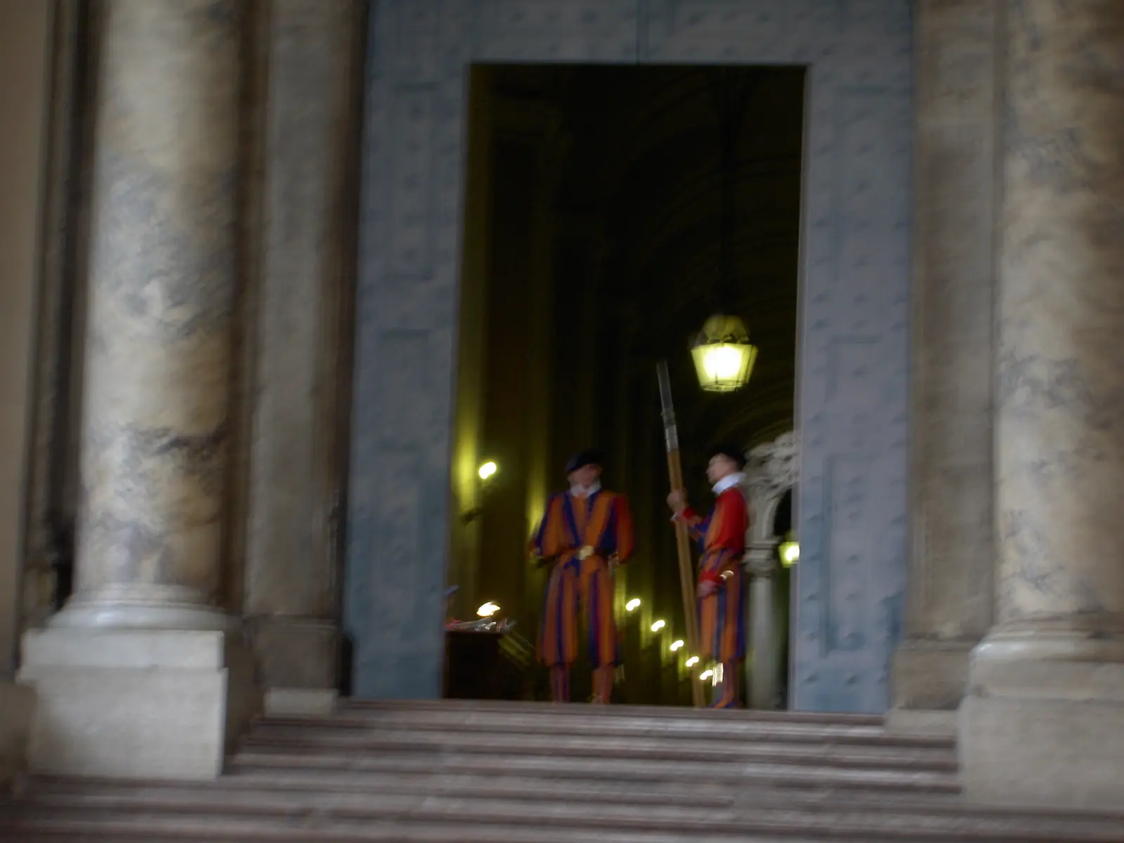 Member's of the Swiss Guard stand at the entrance to the Basilica.