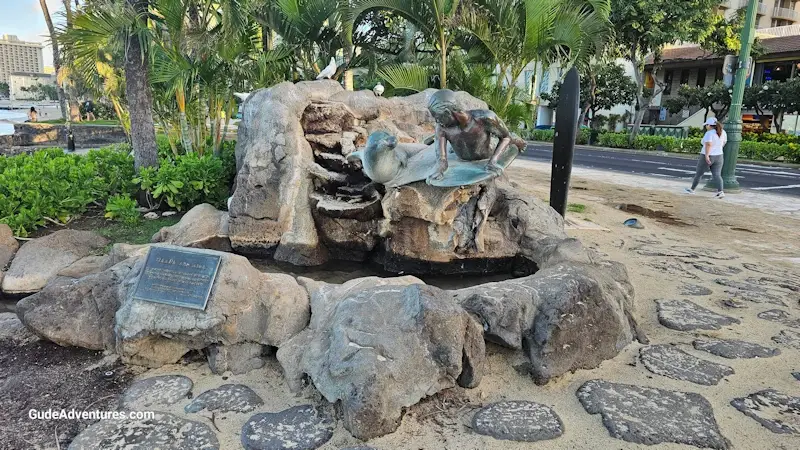 Numerous statues are along the beach at Waikiki.