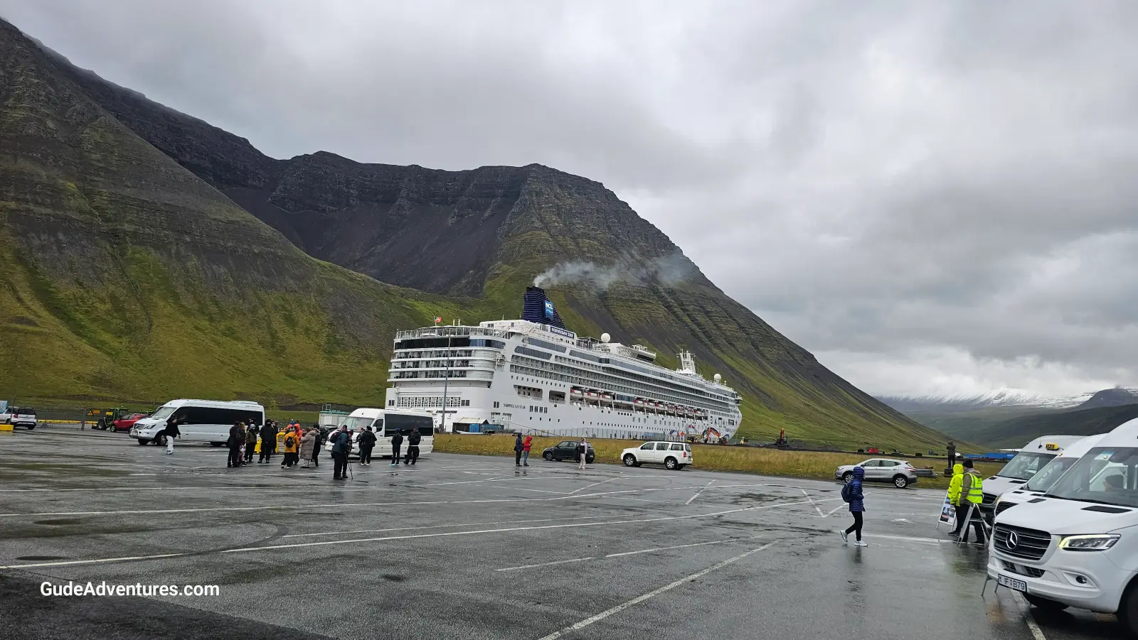 The port at Ísafjörður with the Troll's Seat on the mountainside above the ship.